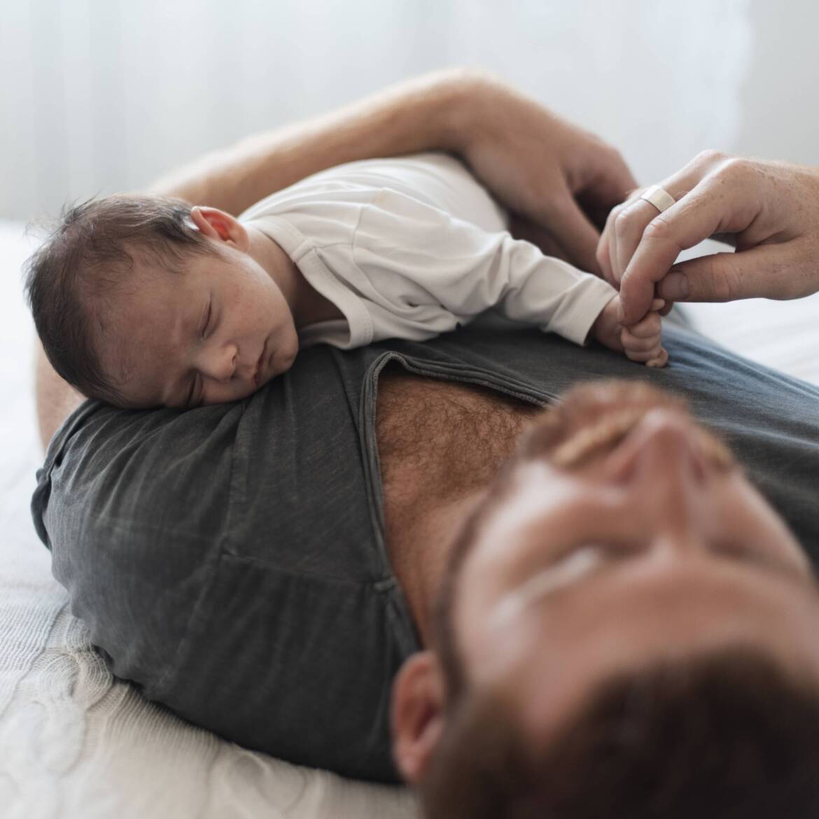 close-up-baby-sleeping-dad-s-chest-1-scaled.jpg